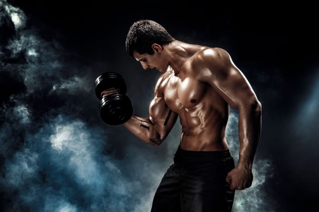 concentrated-muscular-man-doing-exercise-with-dumbbell.jpg