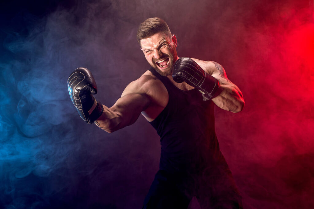 sportsman-muay-thai-boxer-fighting-on-black-wall-with-smoke