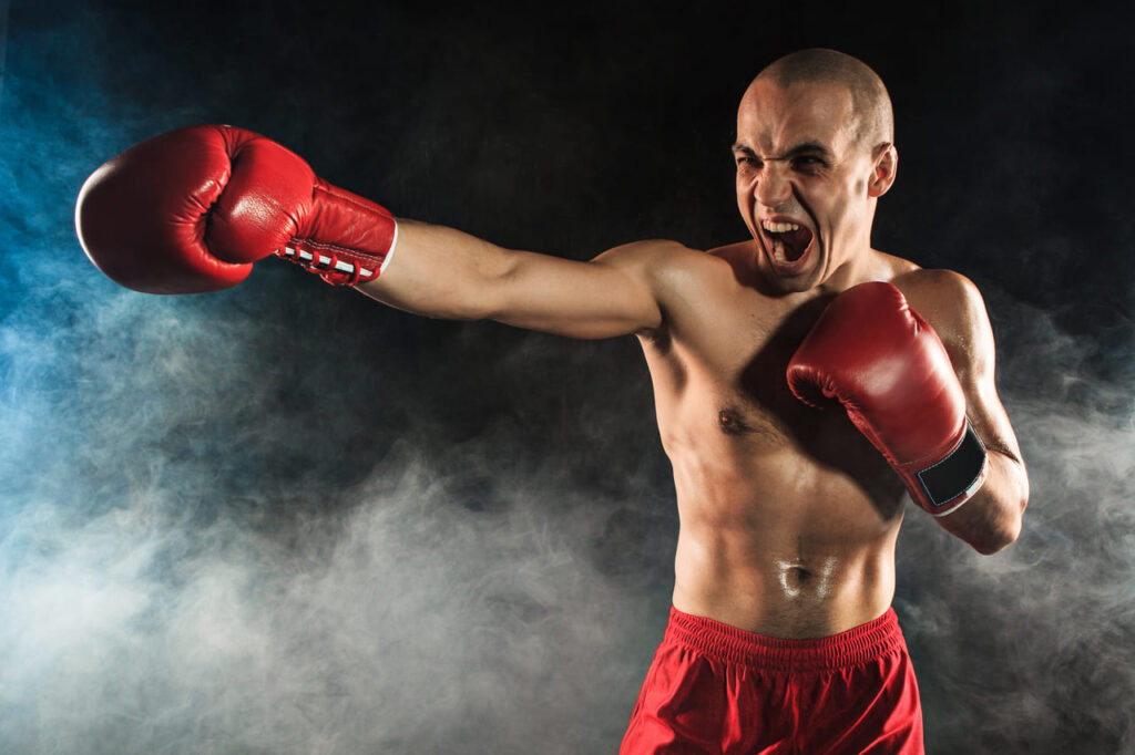 the-young-man-kickboxing-in-blue-smoke-1.jpg