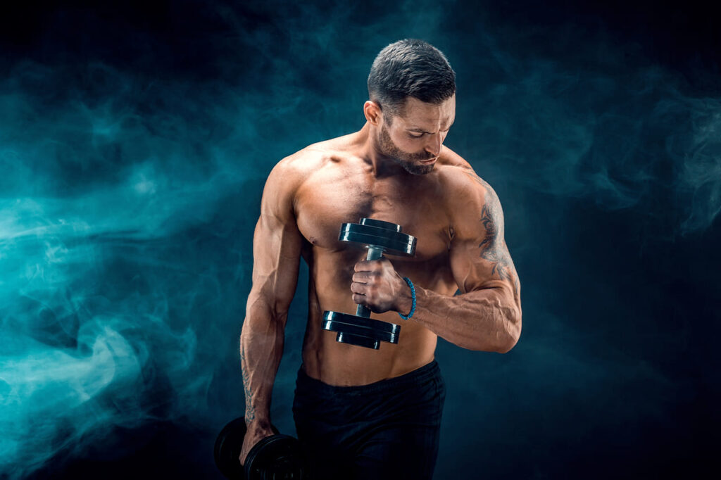 young-ripped-man-bodybuilder-with-perfect-abs-shoulders-biceps-triceps-and-chest-posing-with-a-dumbbell-1.jpg